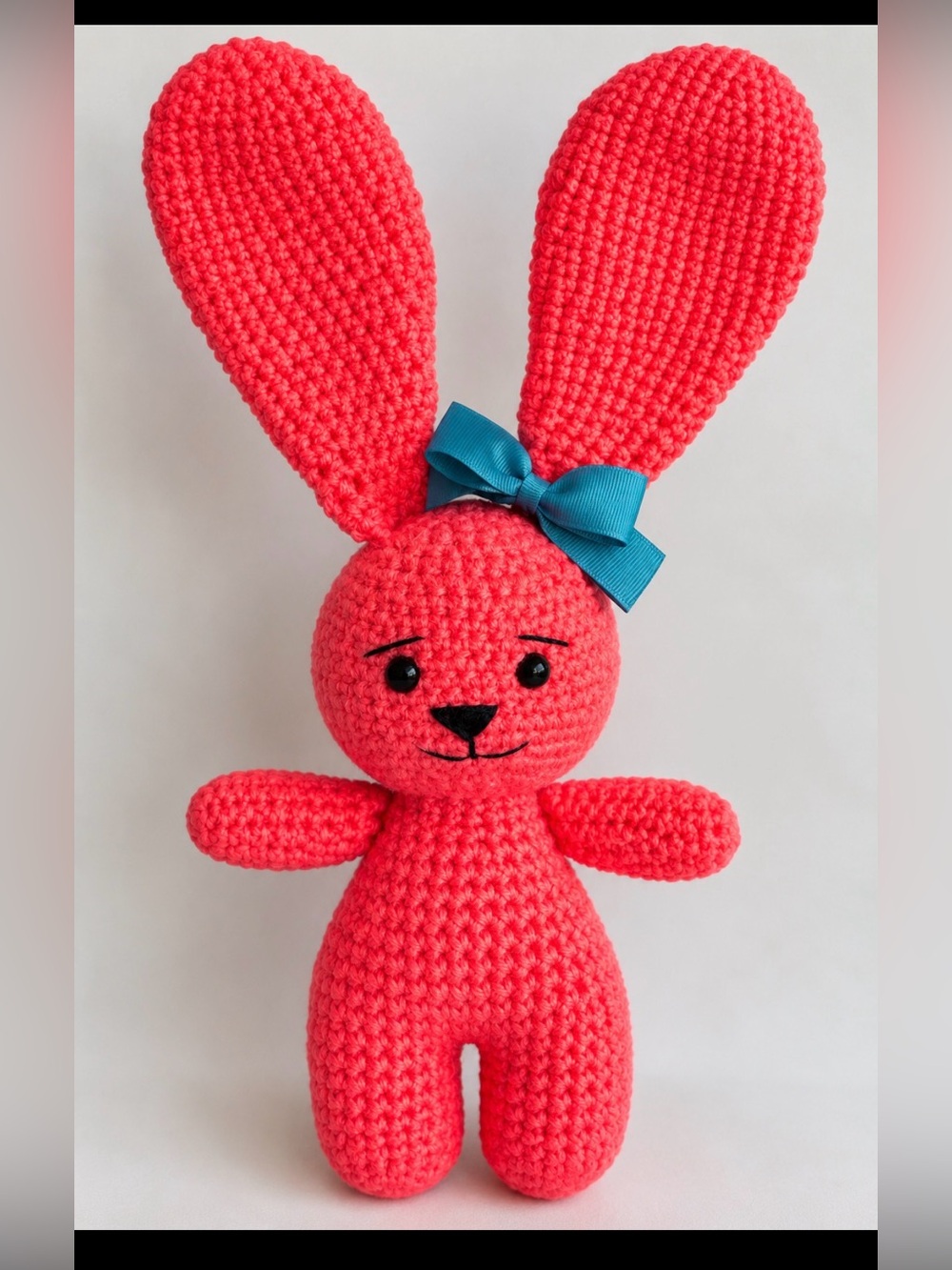 Handmade Coral Crochet Bunny Plush with Teal Bow